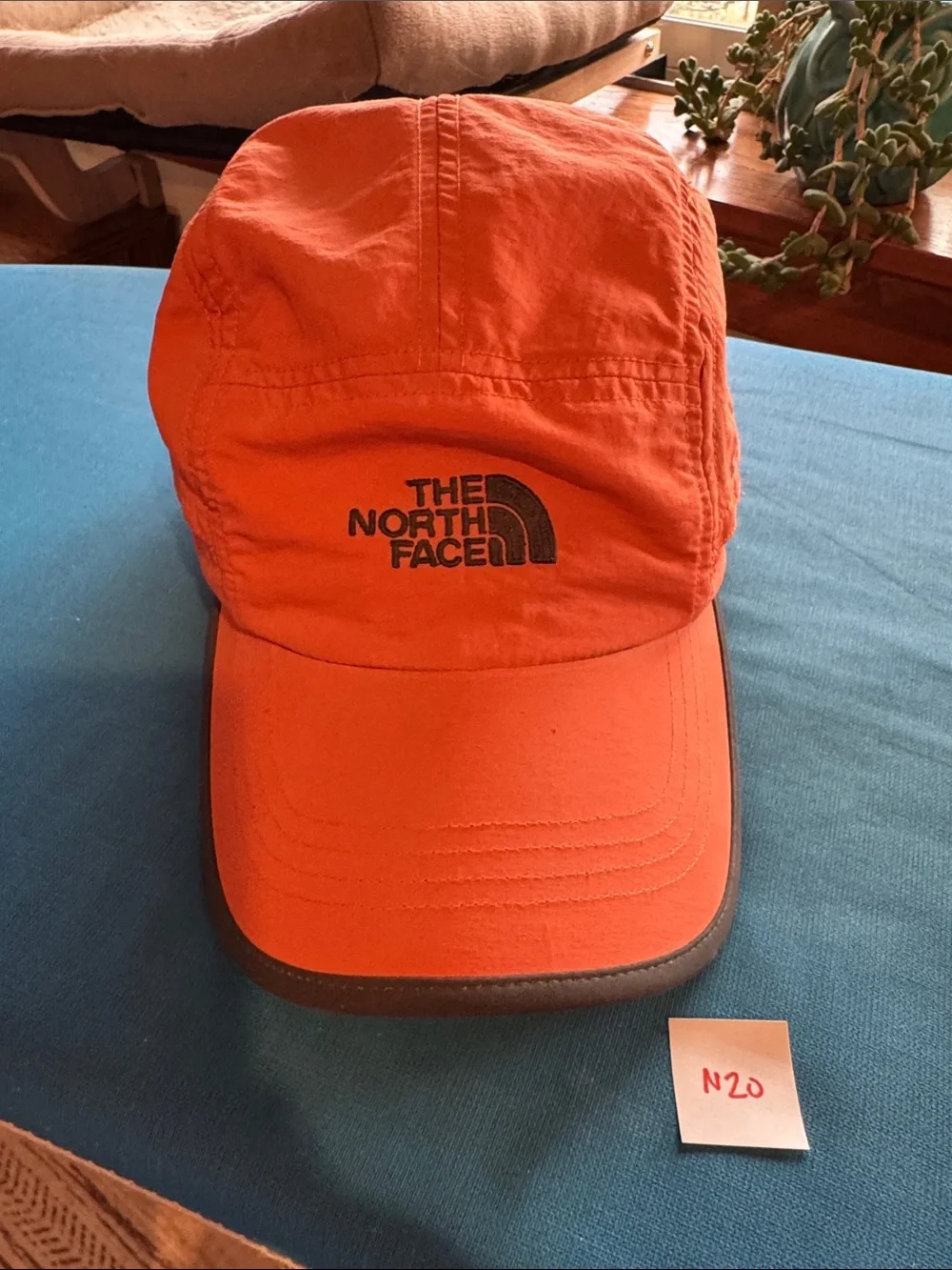 The North Face Orange Men's Trail Hat with Black Logo